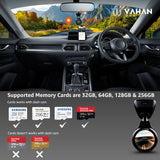 Car interior with a mounted device displaying Vahan branding and memory card compatibility information.